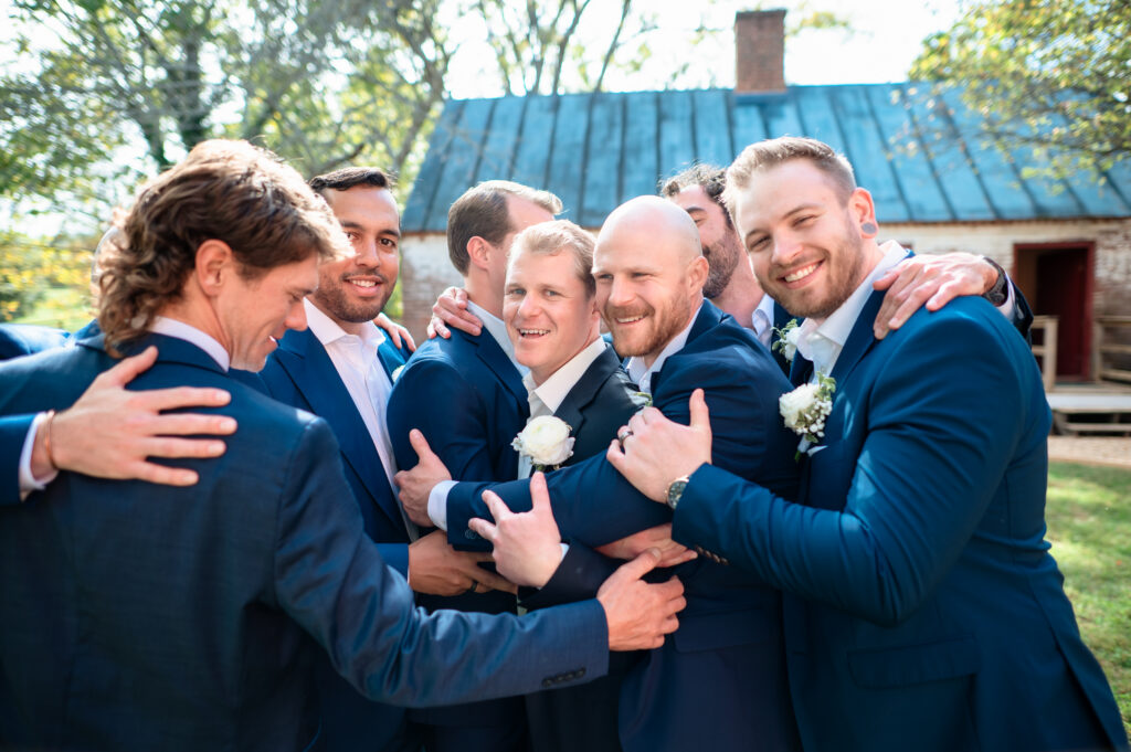 Groom getting ready with his groomsmen before the ceremony.