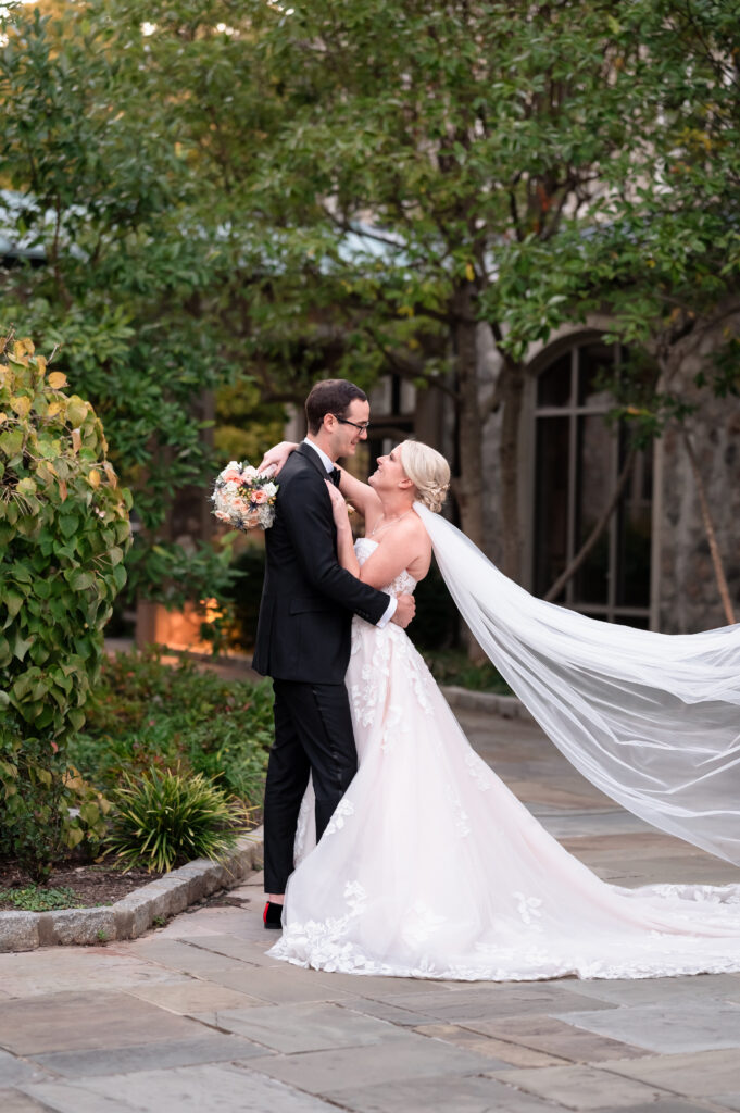 Bride and groom holding hands during their wedding ceremony.